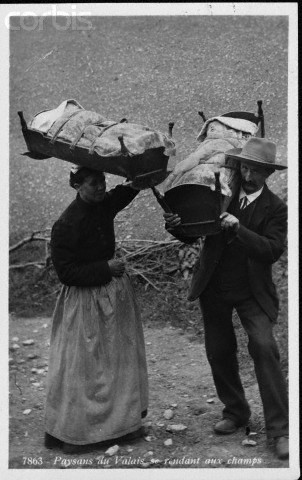 Swiss Couple Carrying Cradles